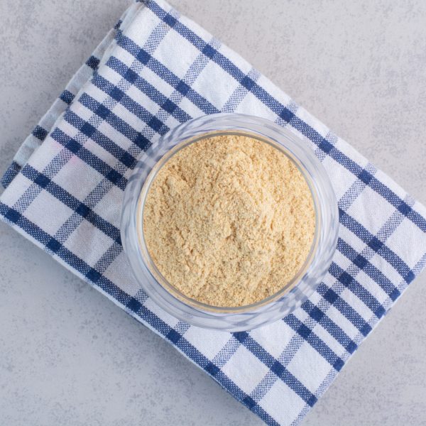 Blended sesame powder in a glass cup. High quality photo